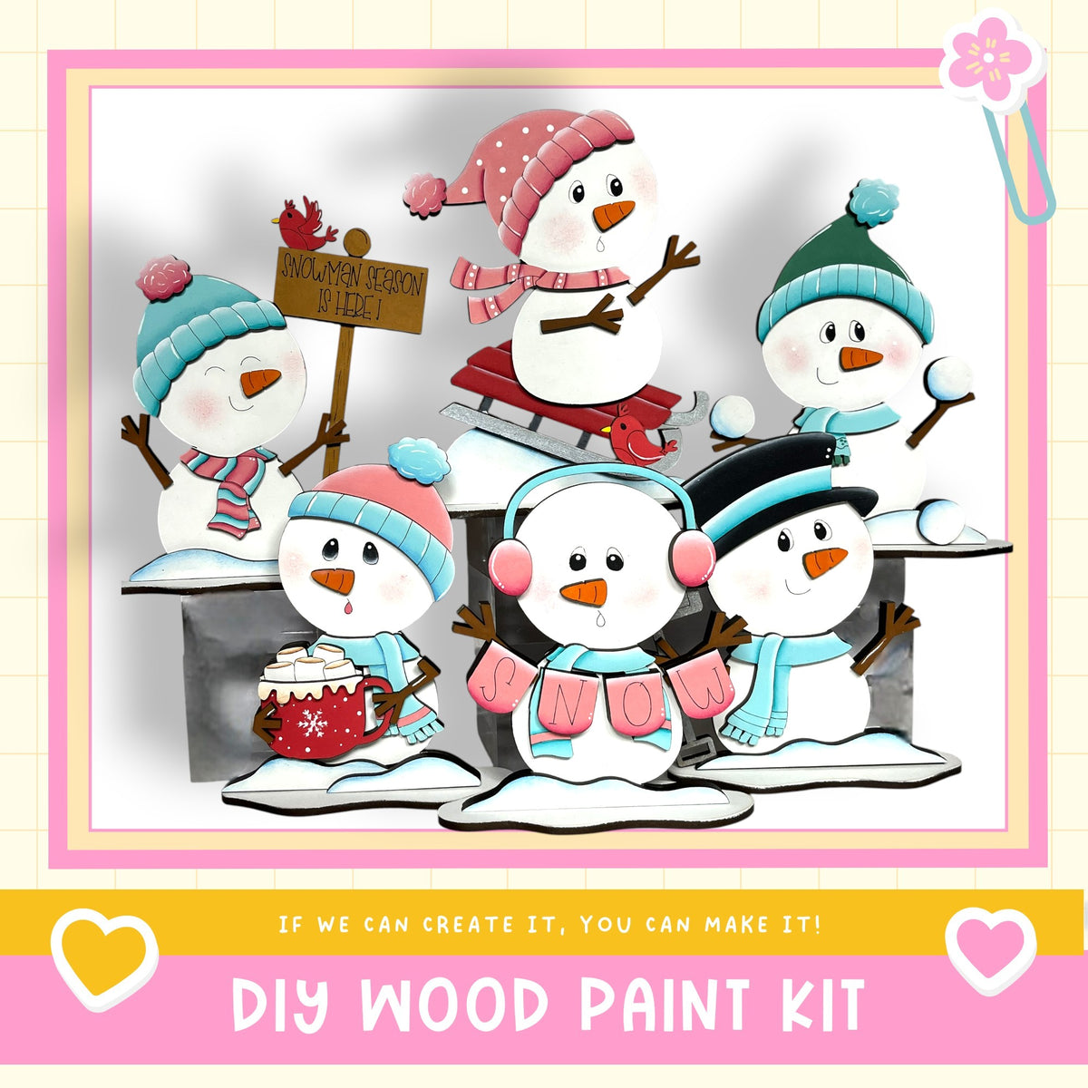 A group of five colorful snowmen, each with unique accessories and clothing, are depicted in a cheerful winter scene. The snowmen are arranged in a row, with one on the left, one in the center, one on the right, and one on the far right. The background is a simple white, and the image includes text that reads "If we can create it, you can make it!" and "DIY WOOD PAINT KIT".