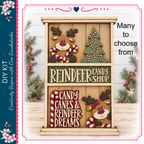 A wooden shelf displaying a reindeer and candy canes, with the text "REINDeer CANDY SHOP" and "CANDY CANES & REINDeer DREAMS" written on it.