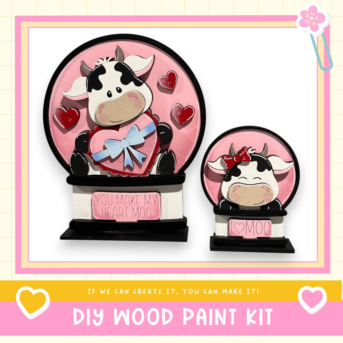 two wooden figurines of cows, one larger and one smaller, both with hearts around them. The larger cow is holding a heart-shaped sign that says "You make my heart moo", and the smaller cow is holding a heart-shaped sign that says "I love moo". The image also includes text that says "If we can create it, you can make it!" and "DIY WOOD PAINT KIT".
