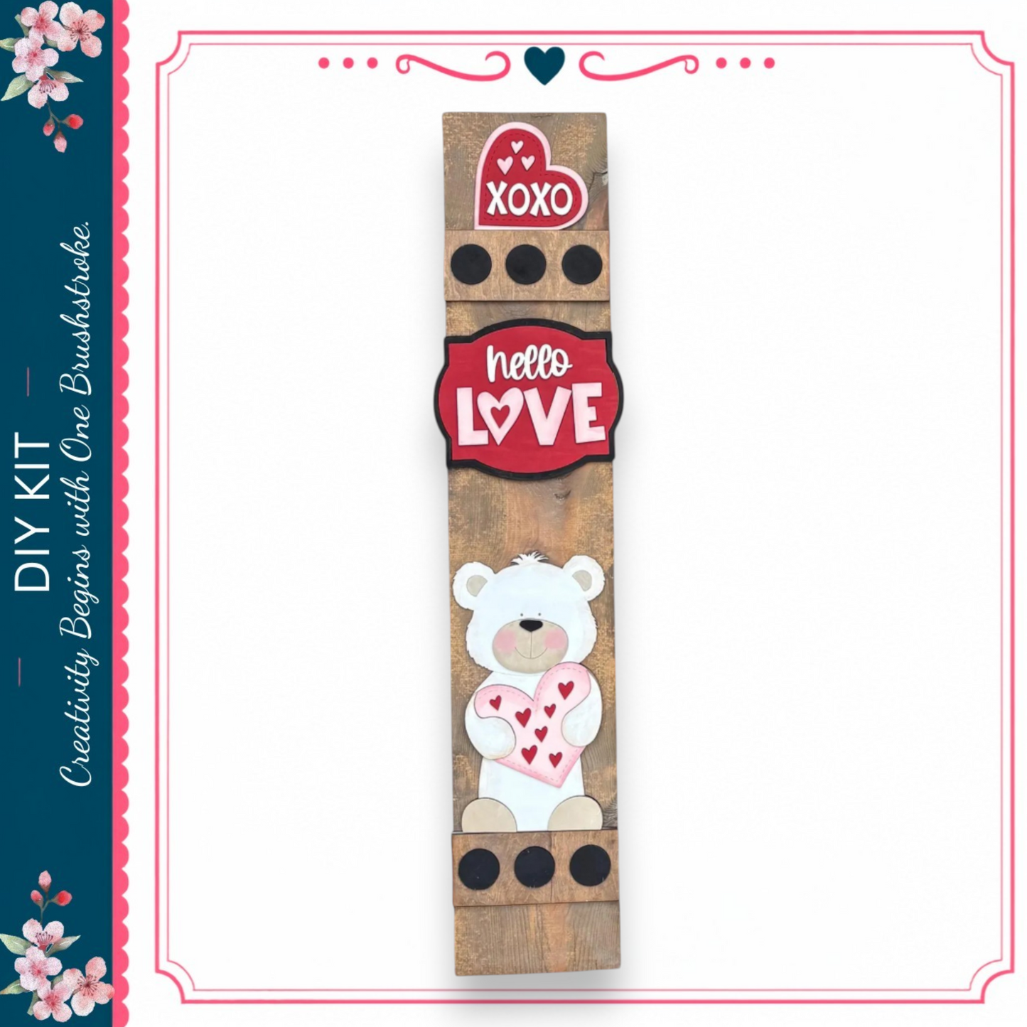 a wooden sign with a teddy bear and hearts, along with the words "XOXO" and "Hello Love" displayed on it.