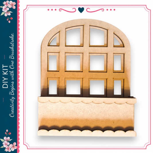 a wooden cutout of a window with a scalloped edge, set against a white background.