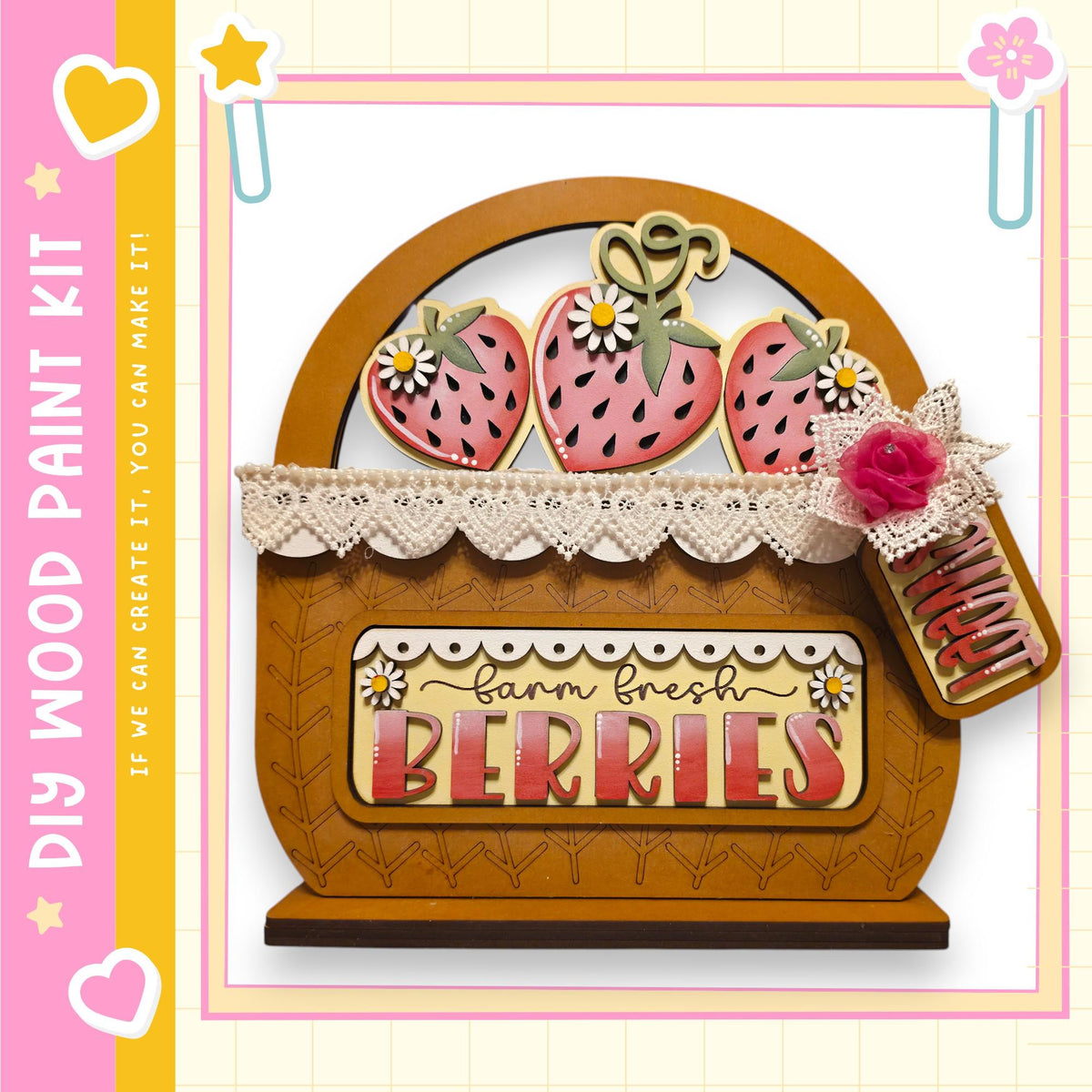 a wooden basket with a sign that says "Farm fresh berries" on it. The basket is decorated with lace and has three strawberry-shaped cookies on top. The sign is attached to the basket with a ribbon.
