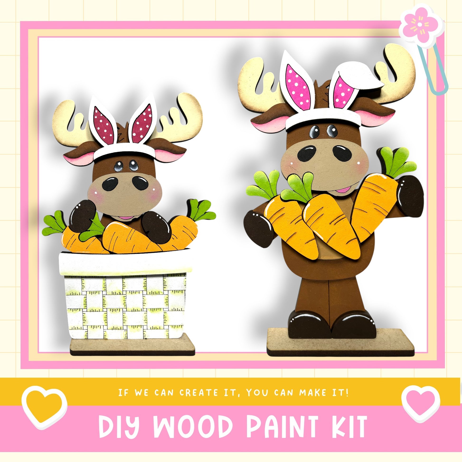 two wooden moose figurines, each holding a basket of carrots. The moose are wearing antlers and have pink ears. The image also includes text that says "DIY WOOD PAINT KIT" and "If we can create it, you can make it!"