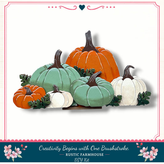 A collection of six pumpkins in various colors, including green, orange, and white, arranged in a visually appealing manner.