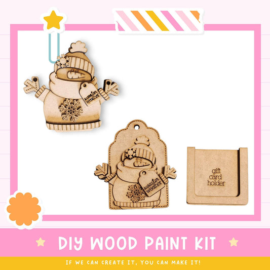 The image is a DIY wood paint kit featuring a wooden snowman and a wooden gift card holder.