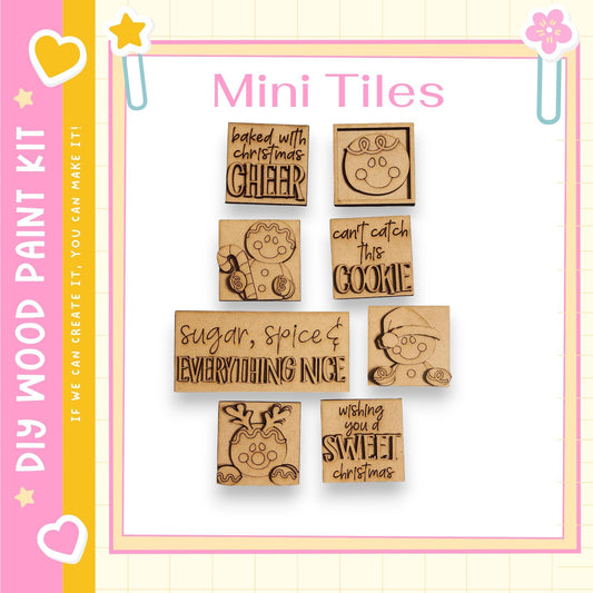 a collection of nine wooden tiles with various holiday-themed sayings and illustrations, including "baked with love", "cheer", "can't catch this cookie", "sugar, spice & everything nice", "wishing you a sweet christmas", and "the image depicts", "the image displays", "the image shows", "the image captures", "the image features", "the image depicts", "the image displays", "the image shows", "the image captures", "the image features".