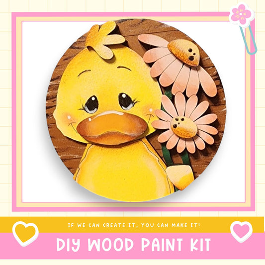 a picture of a yellow duck with flowers