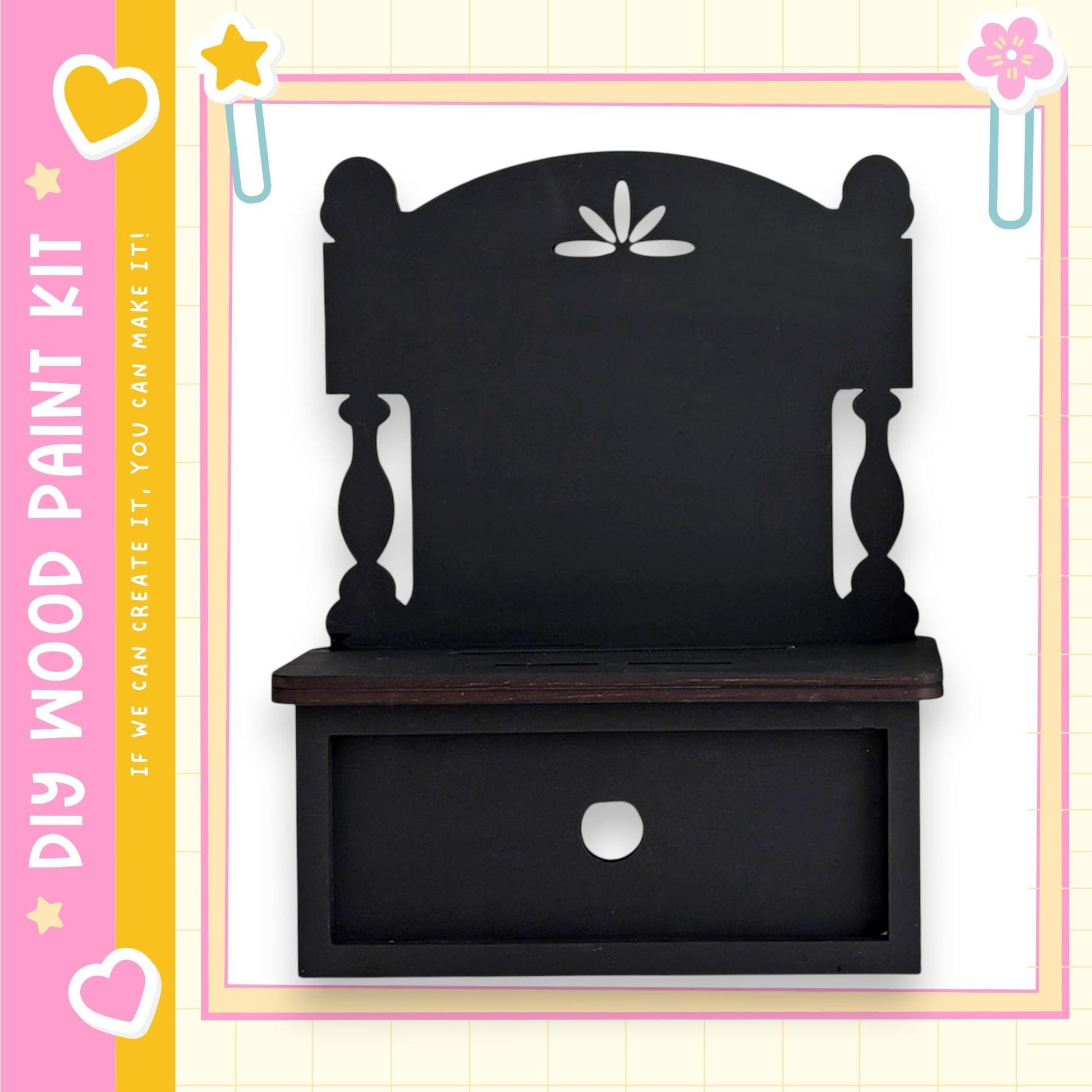 a black wooden shelf with a drawer, set against a pink and yellow background with decorative elements.