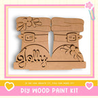 A DIY wood paint kit featuring a pair of wooden boots with the word "Jolly" carved into them.