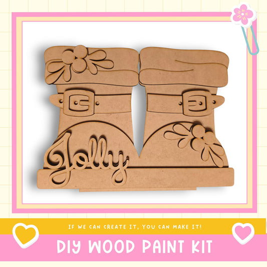 A DIY wood paint kit featuring a pair of wooden boots with the word "Jolly" carved into them.