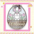 a welcome sign with a bunny in a basket
