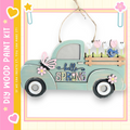 A wooden truck with a floral design and the text "Hello Spring" on it, hanging on a string.