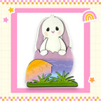 a picture of a white bunny sitting on top of a piece of paper