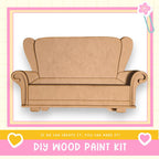 a DIY wood paint kit, with a wooden chair or couch as the main focus. The kit appears to be made of wood and is designed for creating wooden furniture or other wooden projects.