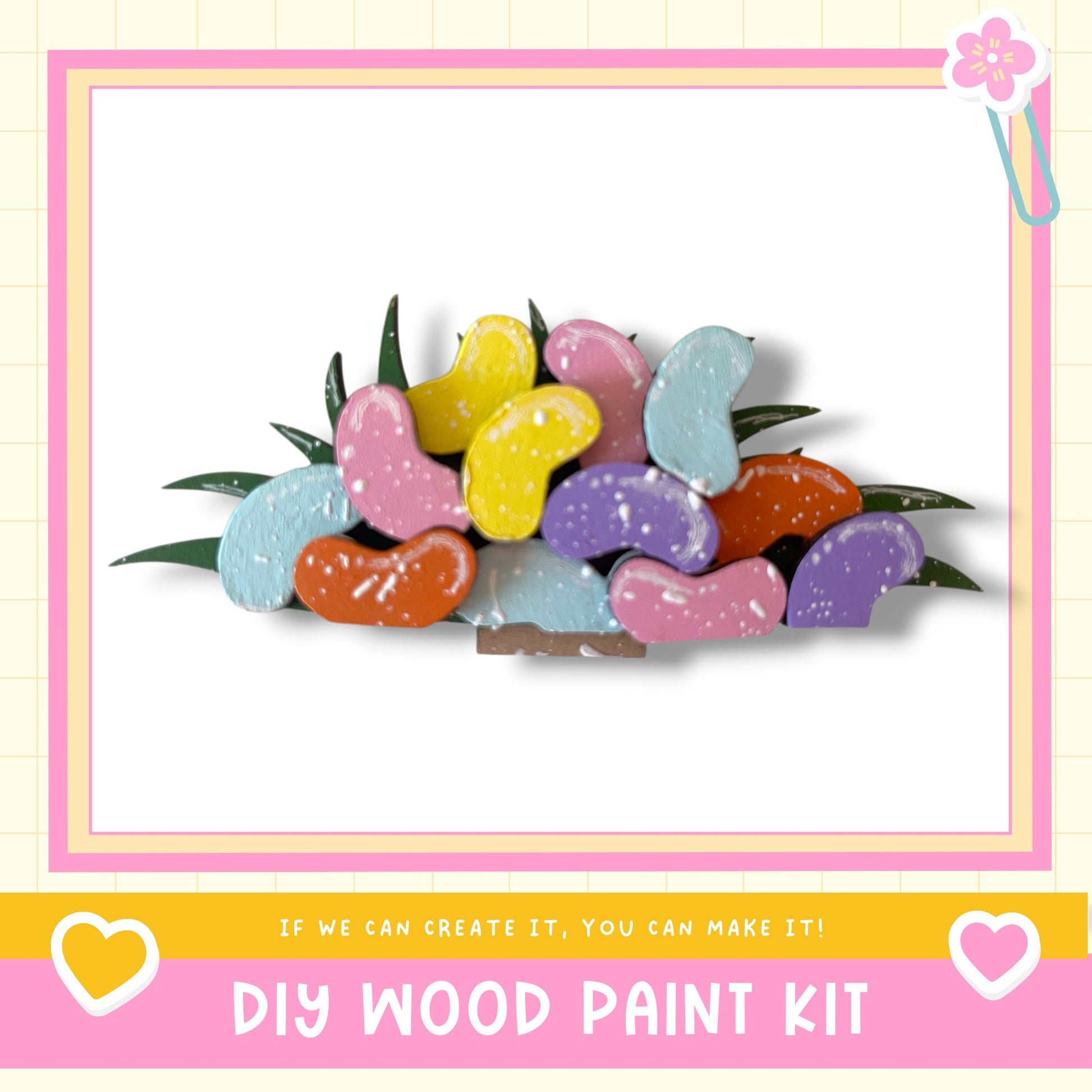 The image is a colorful arrangement of various heart-shaped wooden paint pieces, with a pink and yellow border.