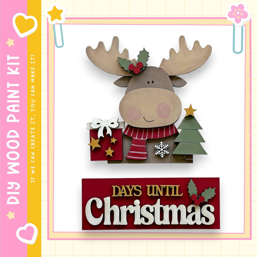 a wooden moose figure holding a gift box and a Christmas tree, with the text "DAYS UNTIL CHRISTMAS" displayed below.