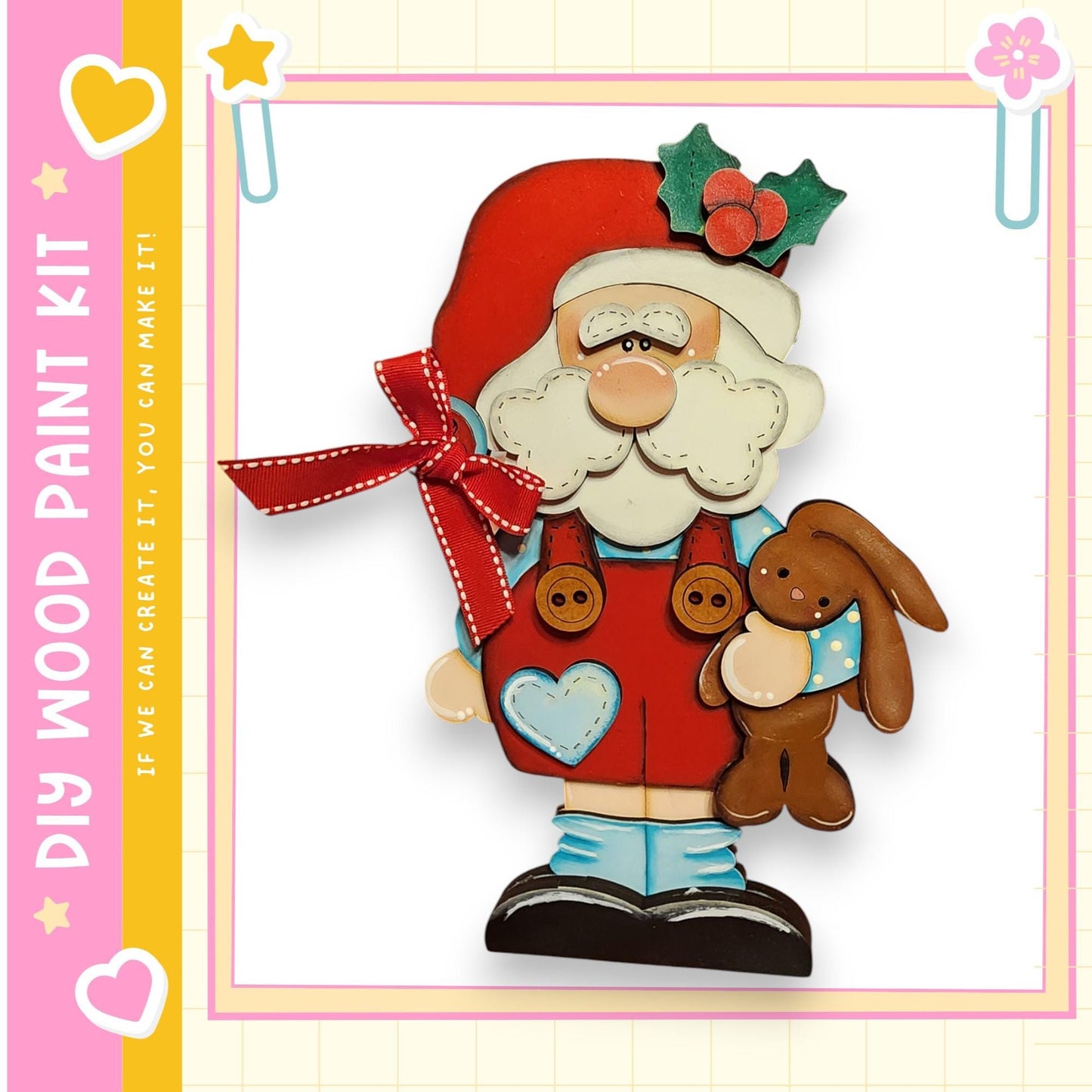A wooden toy figure of Santa Claus holding a brown bunny, with a red bow around his neck and a heart-shaped patch on his chest.