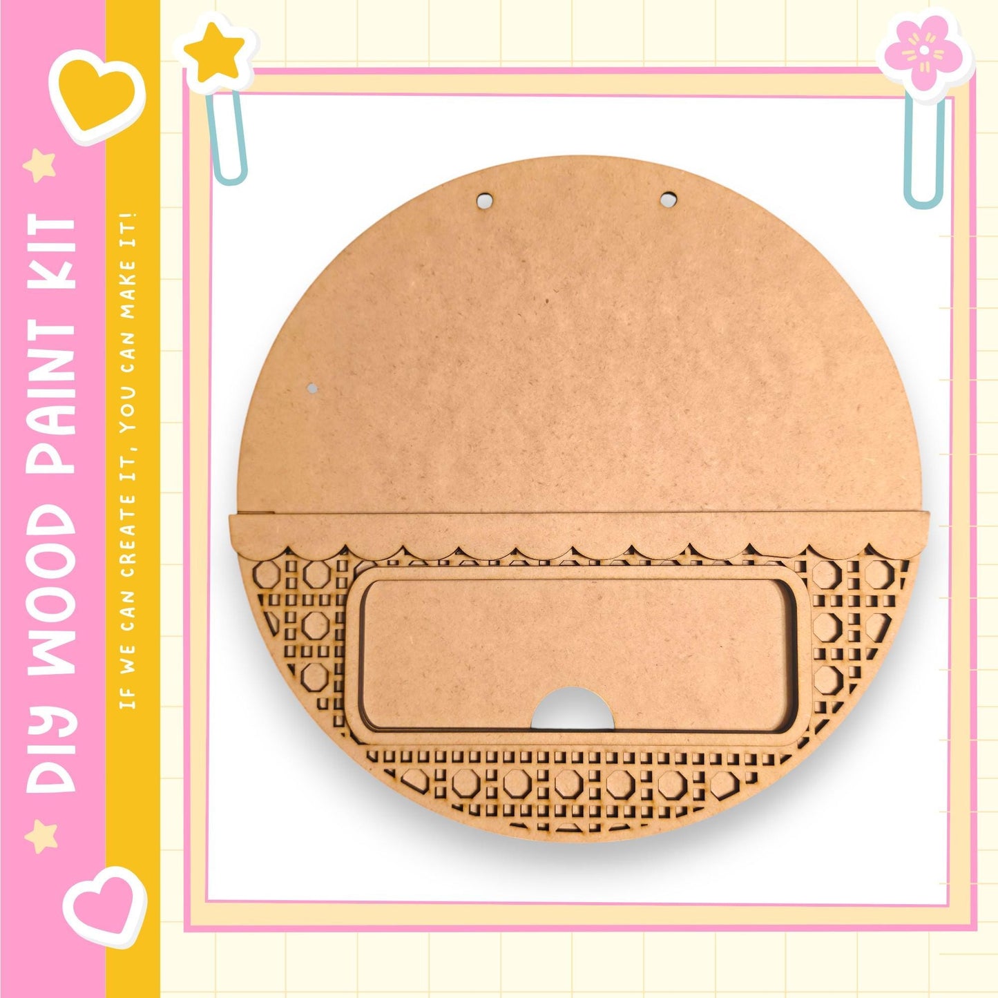 a wooden paint kit with a round, empty wooden piece and a decorative pattern on it, set against a pink and yellow background with a heart and star motif.