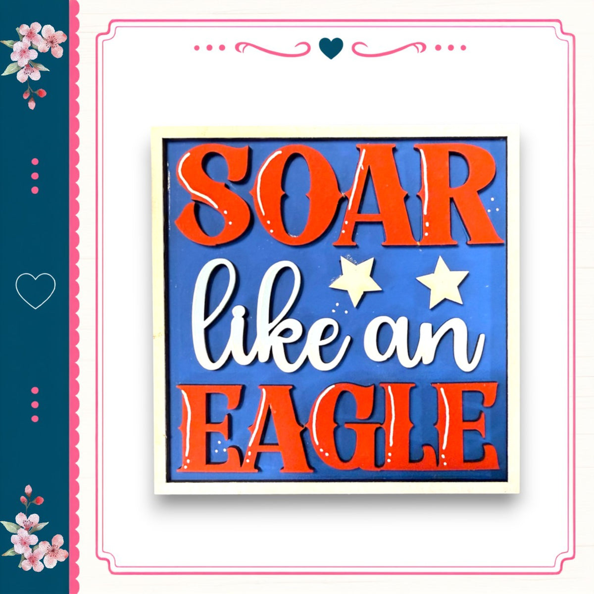 a patriotic-themed sign with the text "SOAR like an EAGLE" in bold red and white letters.