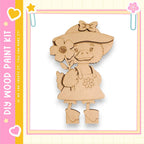 A wooden cutout of a cartoon duck holding a flower, set against a pink and yellow background with decorative elements.