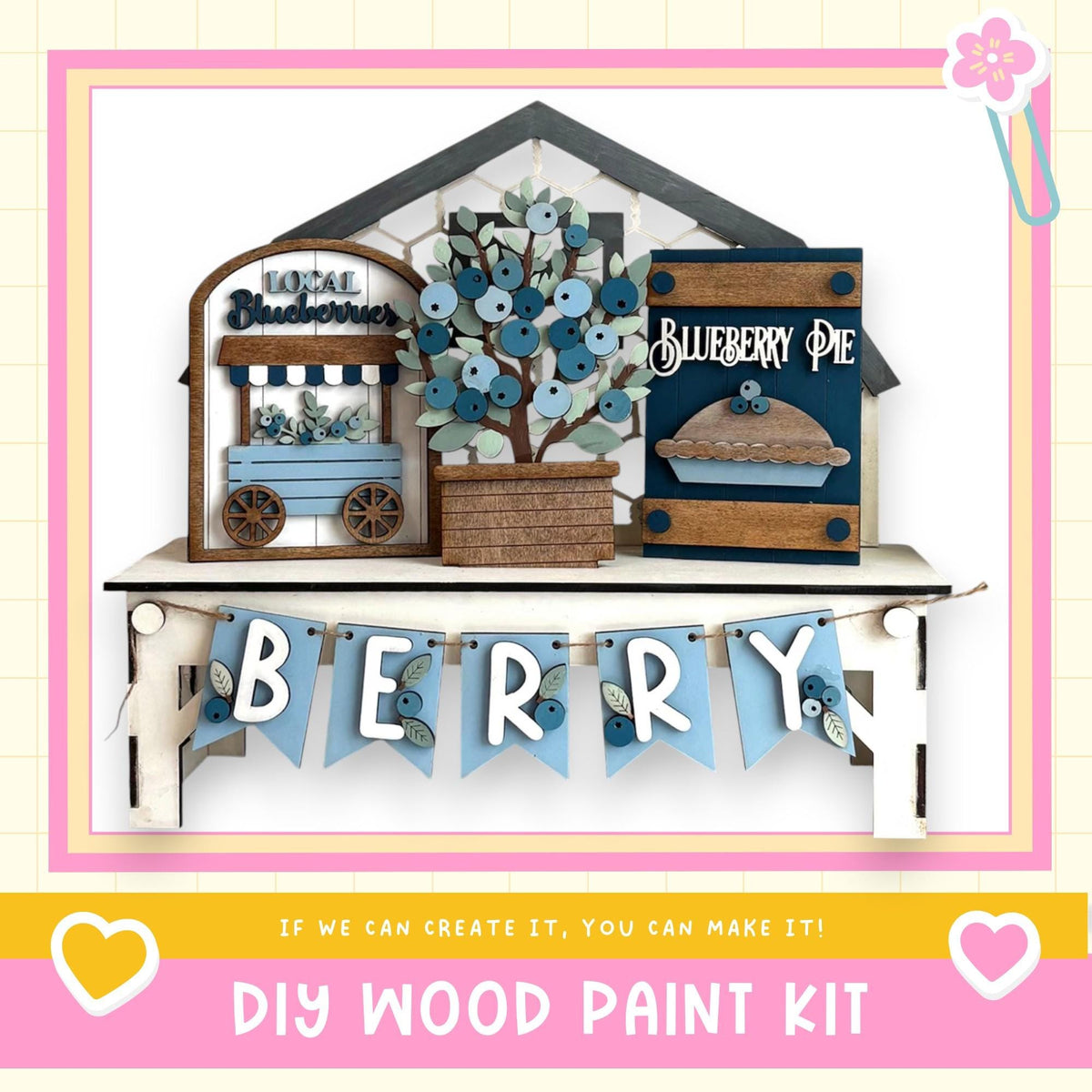The image is a DIY wood paint kit for creating a wooden sign or decoration with the word "Berry" written on it. The sign is made of wood and features a blueberry pie and a blueberry tree as part of the design. The kit includes the necessary materials and instructions for creating a similar wooden sign or decoration.
