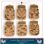 six wooden mason jar ornaments with various designs, including snowflakes, hearts, and a house, arranged in a grid.