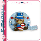 A wooden cutout of a horse wearing a top hat and holding an American flag, surrounded by stars and flowers, with a sign that says "RED WHITE & MOO".