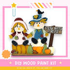 a DIY wood paint kit for creating a scarecrow and a sign that says "Straw Mates Forever". The kit includes a scarecrow made of wood and a sign made of wood, both decorated with various fall-themed elements such as pumpkins and leaves. The kit is designed to be a fun and creative project for anyone interested in making their own scarecrow and sign.