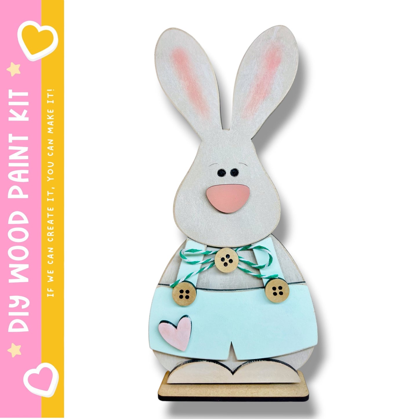 A wooden Easter bunny decoration kit, featuring a light brown bunny with pink ears and a light blue dress with buttons and a heart.