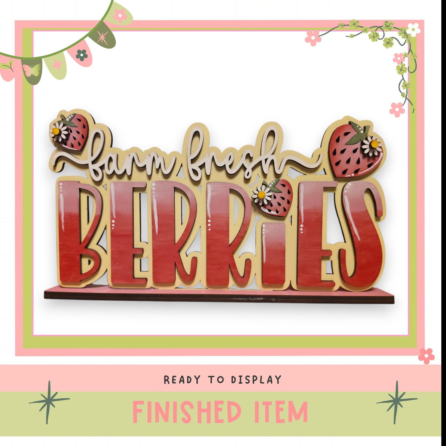 a large wooden sign with the word "BERRIES" written on it, surrounded by decorative elements such as flowers and stars. The sign is placed on a shelf, ready to be displayed.