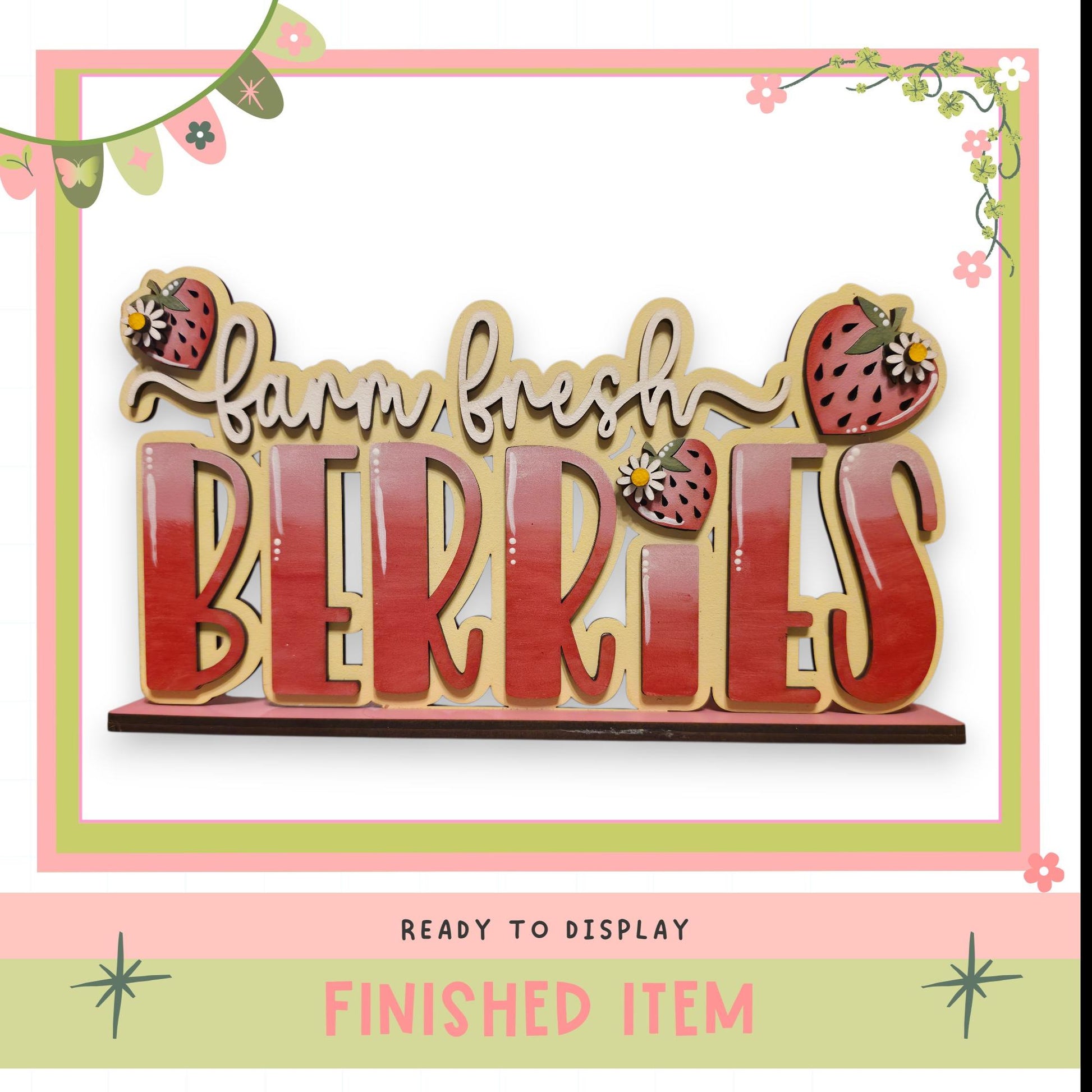 a large wooden sign with the word "BERRIES" written on it, surrounded by decorative elements such as flowers and stars. The sign is placed on a shelf, ready to be displayed.