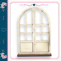 a white wooden archway with a heart symbol above it, set against a white background with a pink and blue border.