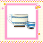 a picture of a cup and saucer with a rainbow in the background