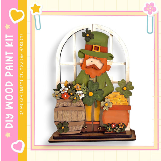 A wooden cutout of a leprechaun figure holding a barrel of gold coins, surrounded by flowers and a window.