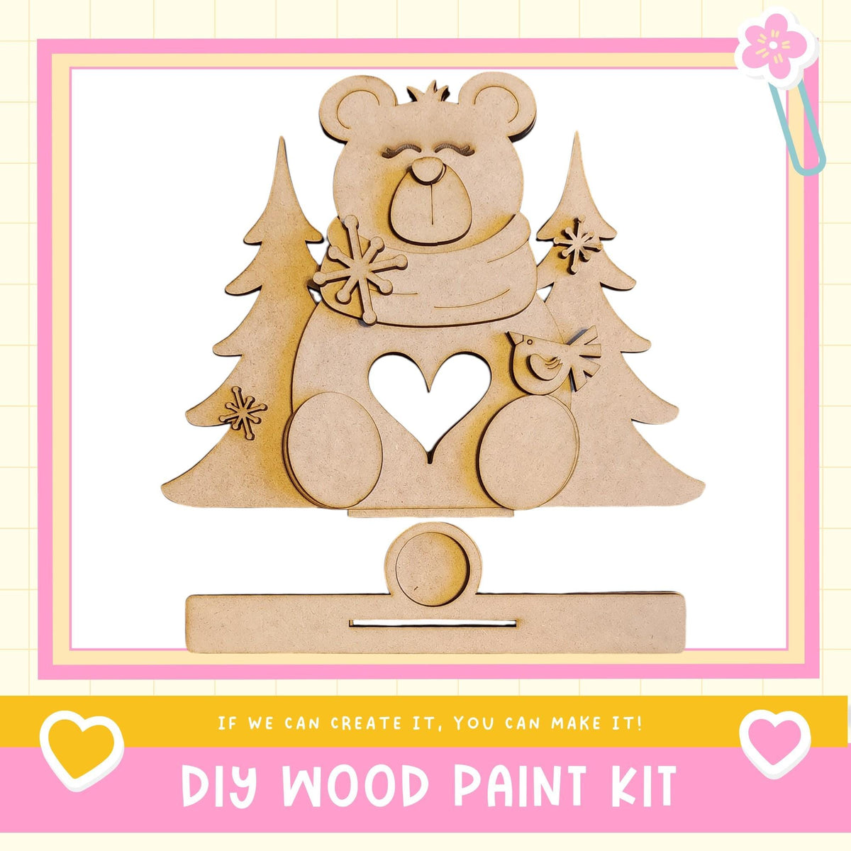 a DIY wood paint kit, with a wooden bear figure and pine trees as the main decorative elements.