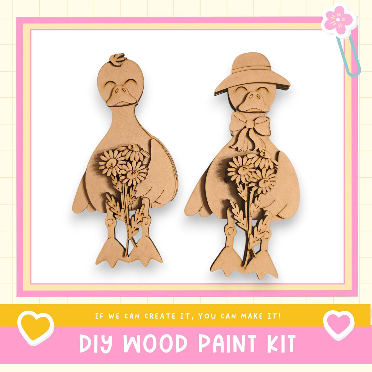two wooden bird figurines, one with a flower in its beak and the other holding a flower in its hand. The image is framed with a pink border and includes text that reads "DIY WOOD PAINT KIT" and "If we can create it, you can make it!"