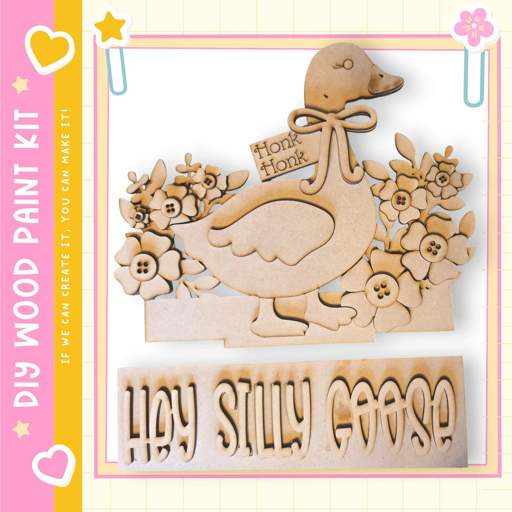 a wooden cutout of a goose with a bow, surrounded by flowers, and the text "Hey Silly Goose" below it.
