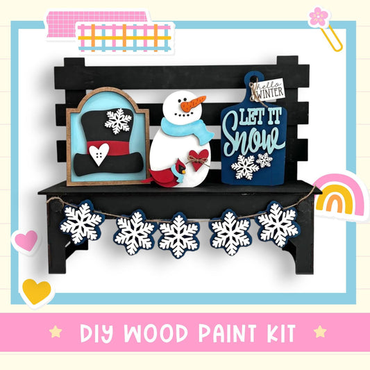 a snowman is sitting on a bench with a snowman decoration