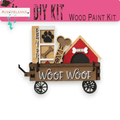 a dog house on a wagon with a dog's paw print on it