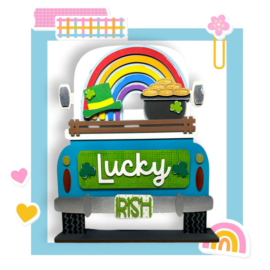 a truck with a rainbow and a pot of gold
