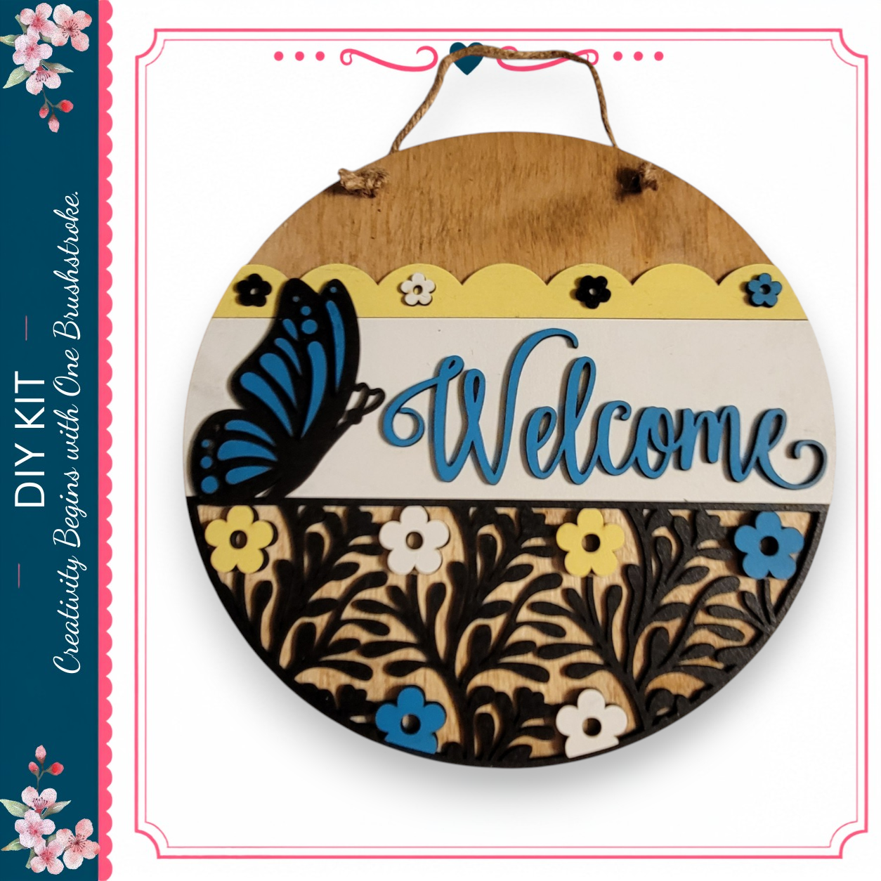a decorative welcome sign with a butterfly and floral designs.