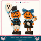 two jack-o-lantern figurines dressed in Halloween costumes, including a top hat, bowtie, and a ghost.