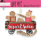 a wooden cutout of a man and woman in a wagon