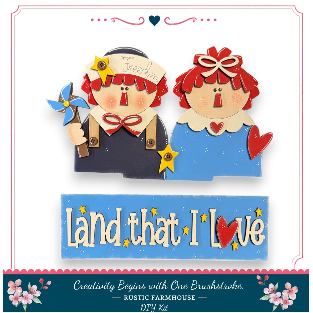 two wooden dolls, one wearing a blue outfit and the other in a red outfit, holding a blue pinwheel and a yellow star. The dolls are set against a white background, and there is a sign that says "Land that I Love" in the foreground.