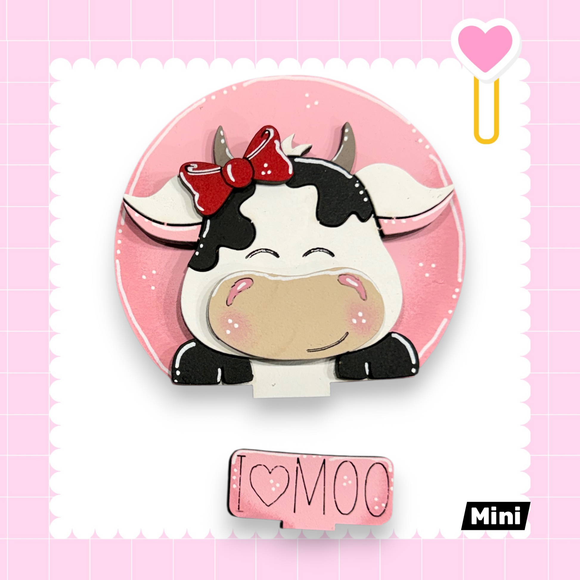 A cute cartoon cow with a bow on its head, surrounded by a pink background with a heart and a pink heart-shaped object.