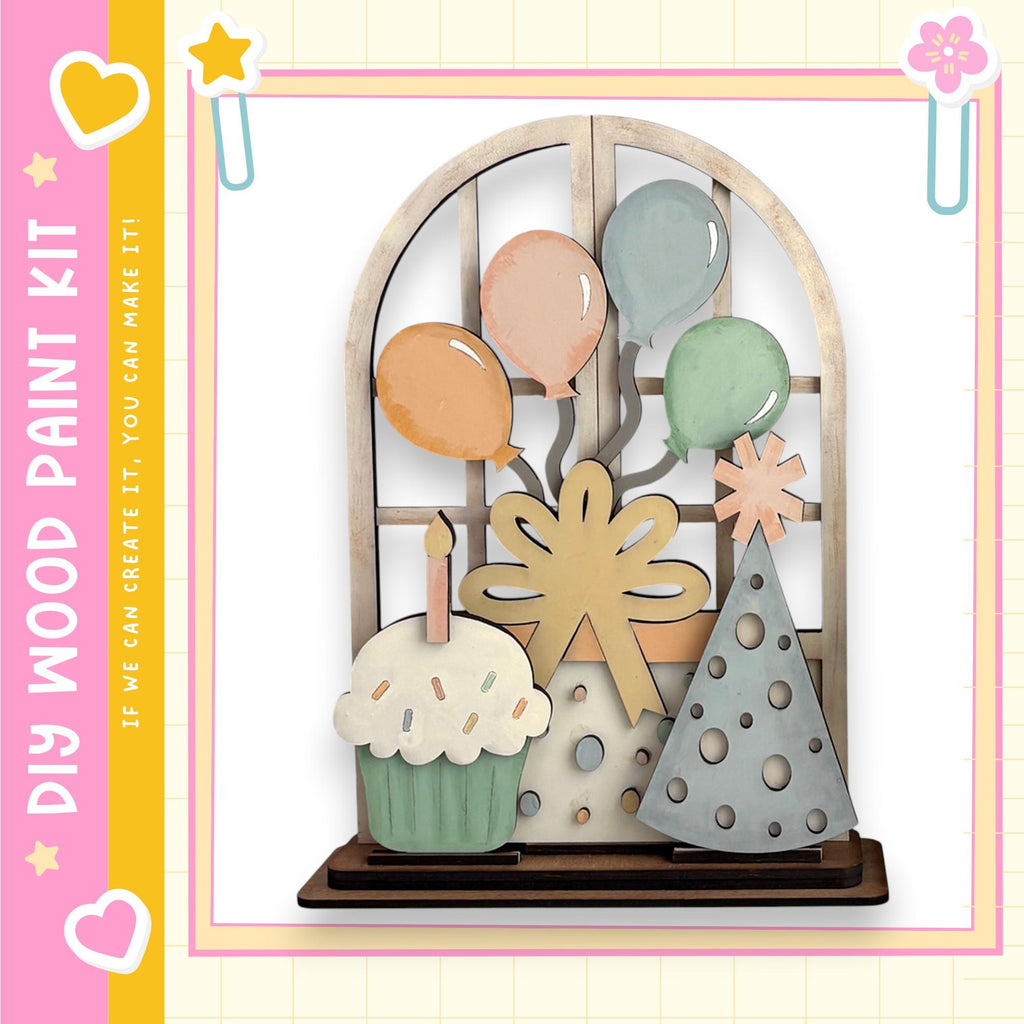 The image is a colorful and whimsical display featuring a cake, balloons, and a bow, all set against a pink and yellow background.