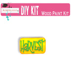 a wooden pin with the word harvest painted on it