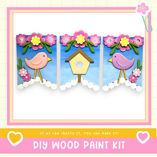 The image is a collage of three pictures, each featuring a bird and a birdhouse. The collage is framed with a pink border and includes text that encourages viewers to create their own wood paint kit.