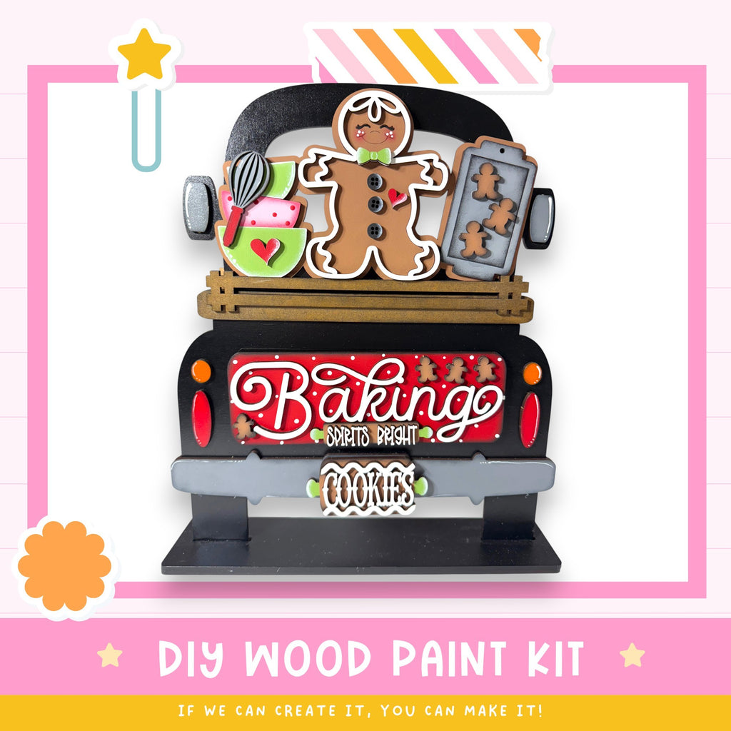 The image is a colorful and whimsical DIY wood paint kit for creating a "Baking Spirit" themed decoration, featuring a gingerbread man, cookies, and other festive elements.