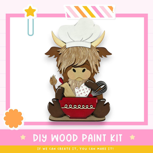 A wooden cutout of a cow wearing a chef's hat and holding a bowl of food, with a pink and white striped border and a star decoration.